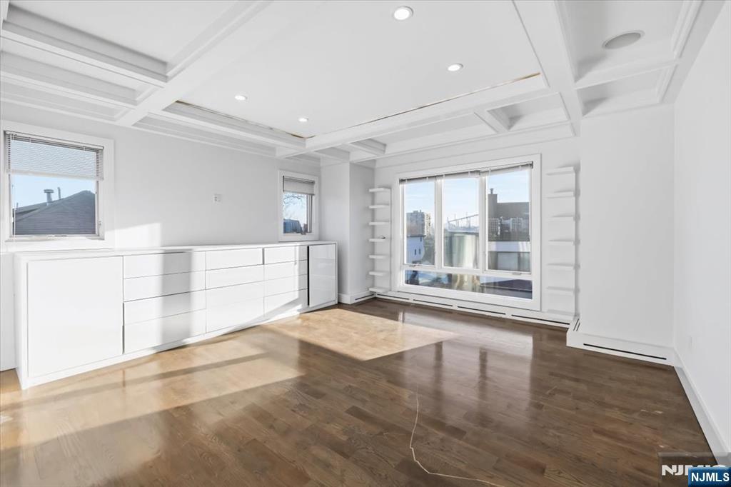 12 Orchard Street, Unit 12 Edgewater, NJ 07020 - Photo 21 of 33 a view of empty room with wooden floor and fan
