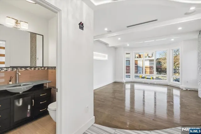 a view of a bathroom with sink and mirror