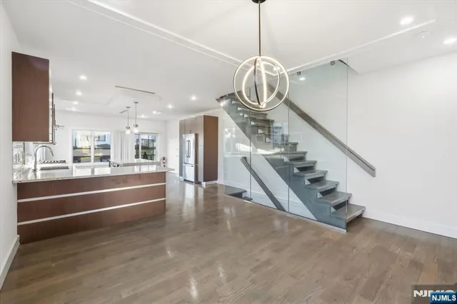 a view of a room with gym equipment and windows