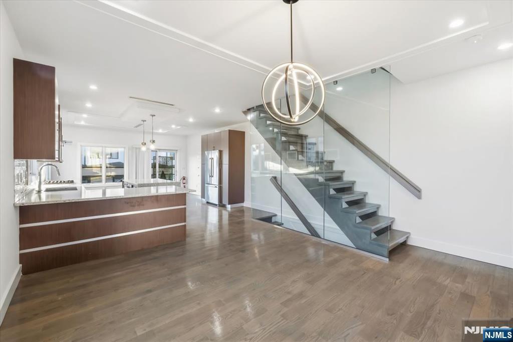 12 Orchard Street, Unit 12 Edgewater, NJ 07020 - Photo 29 of 33 a view of a room with gym equipment and windows