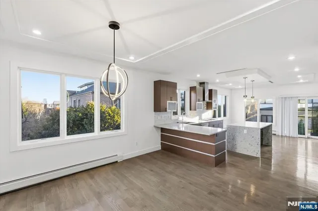 a room with lots of wooden furniture and a chandelier