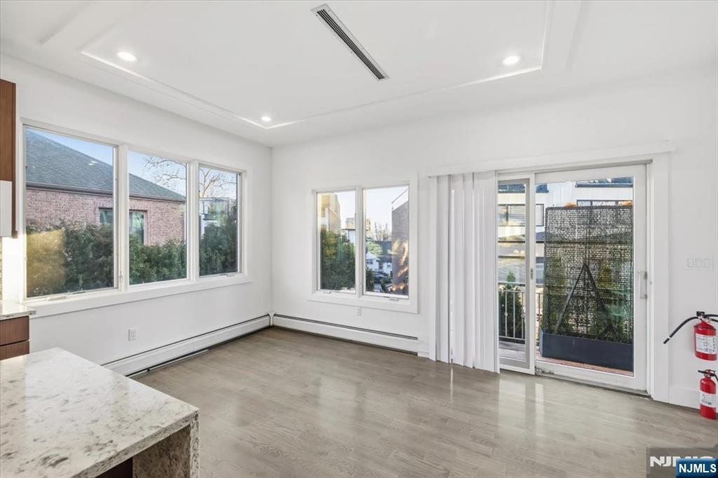12 Orchard Street, Unit 12 Edgewater, NJ 07020 - Photo 3 of 33 a view of an empty room with a window