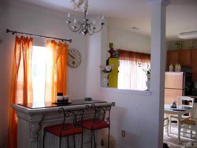 2220 Raven Road Raleigh, NC 27614 - Photo 3 of 8 a view of a dining room with furniture and window