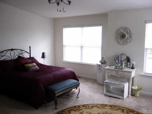 2220 Raven Road Raleigh, NC 27614 - Photo 5 of 8 a bedroom with a bed and window