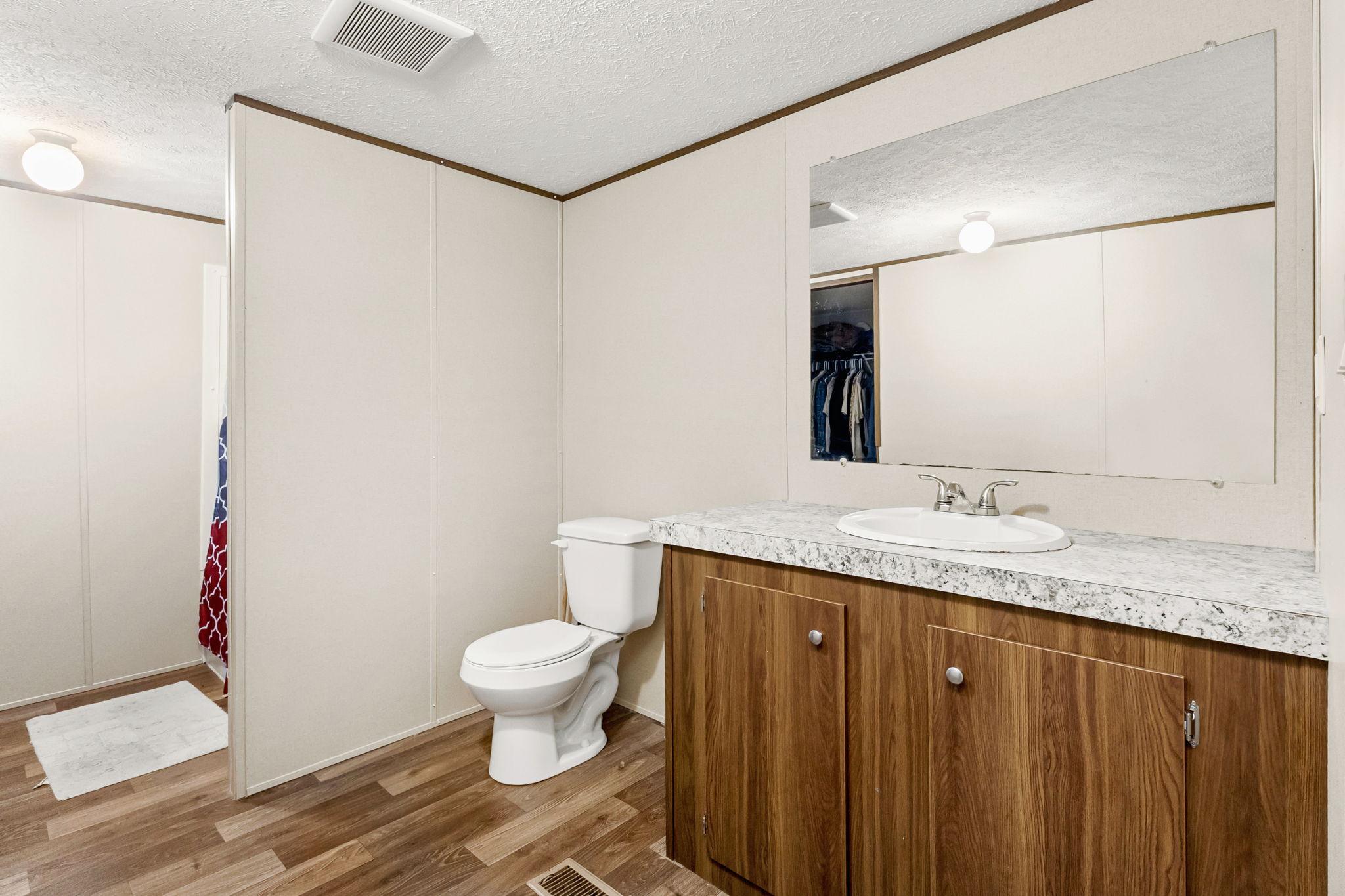 161 High Point Ridge Seguin, TX 78155 - Photo 11 of 23 a bathroom with a granite countertop sink a toilet and a mirror
