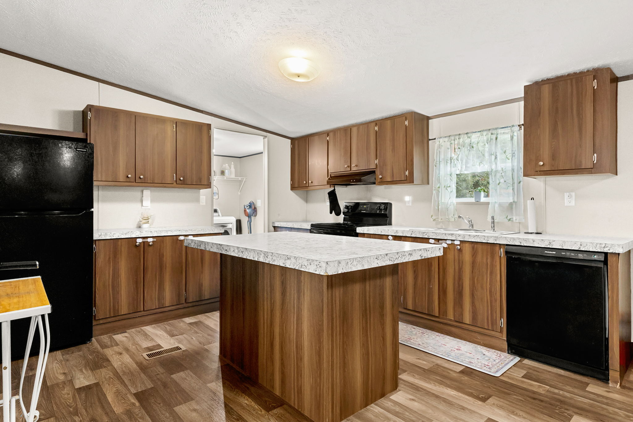 161 High Point Ridge Seguin, TX 78155 - Photo 7 of 23 a kitchen with a sink a stove a refrigerator and cabinets