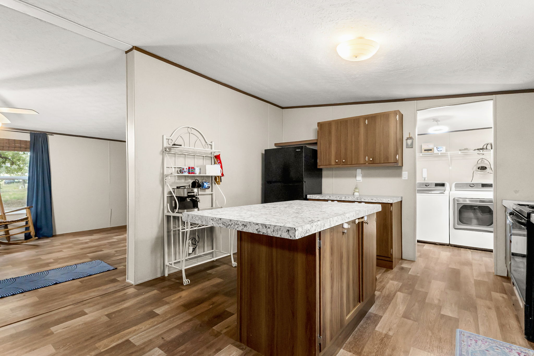 161 High Point Ridge Seguin, TX 78155 - Photo 9 of 23 a kitchen with stainless steel appliances granite countertop a table chairs refrigerator and sink