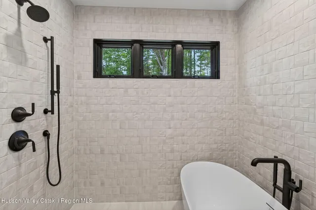 a bathroom with a toilet sink and shower