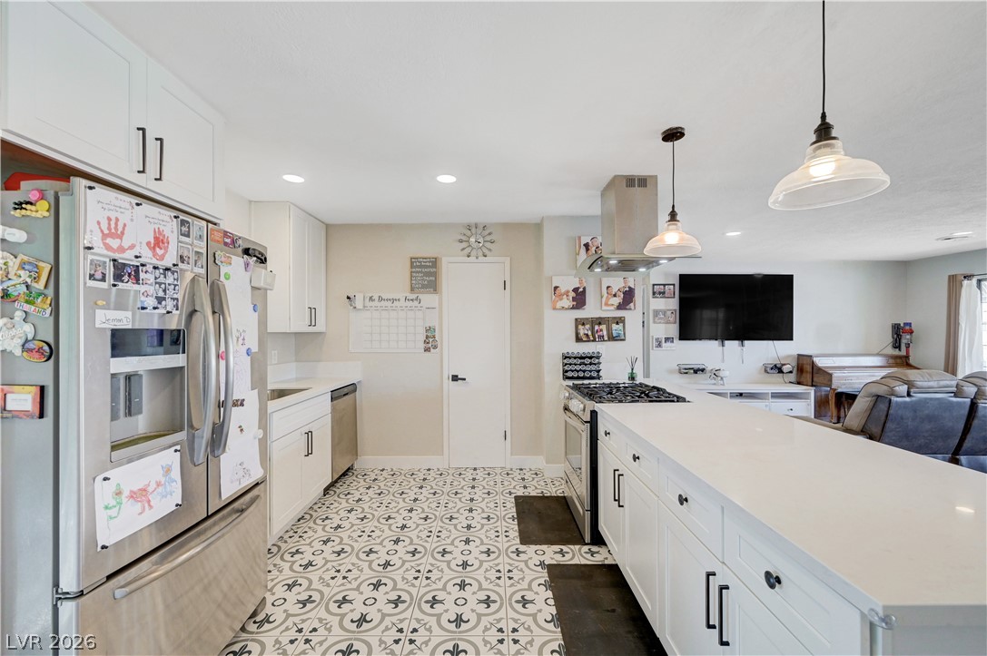 1331 Pinto Road Boulder City, NV 89005 - Photo 20 of 46 A well-appointed kitchen features a large central island and stainless steel appliances, creating a functional culinary space.