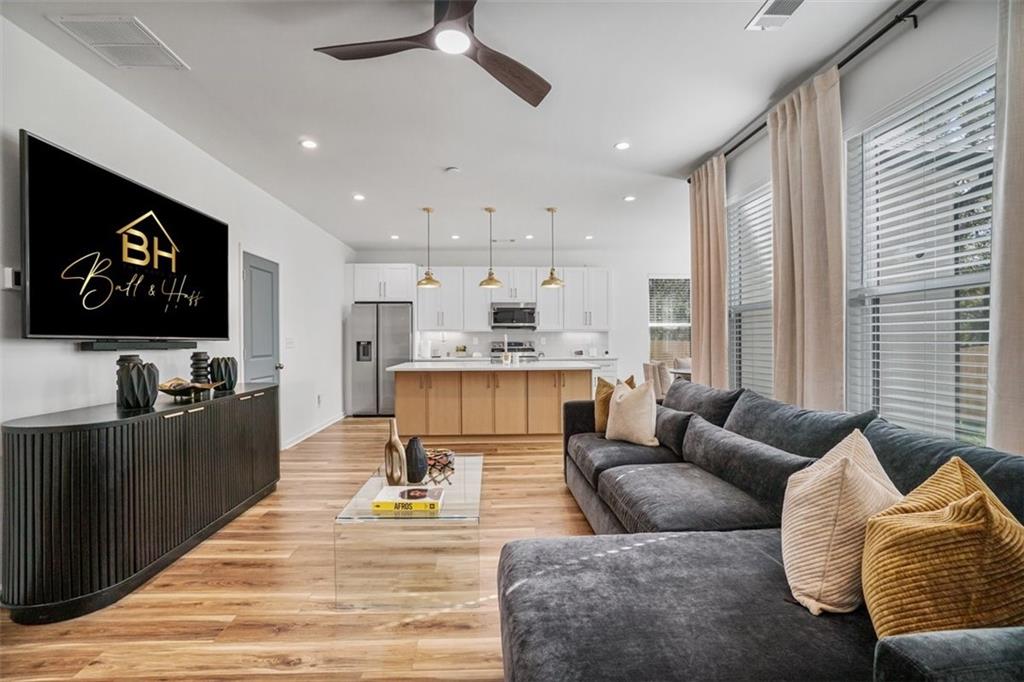 3510 Thompson Drive Northwest Atlanta, GA 30331 - Photo 14 of 28 a living room with furniture and a flat screen tv