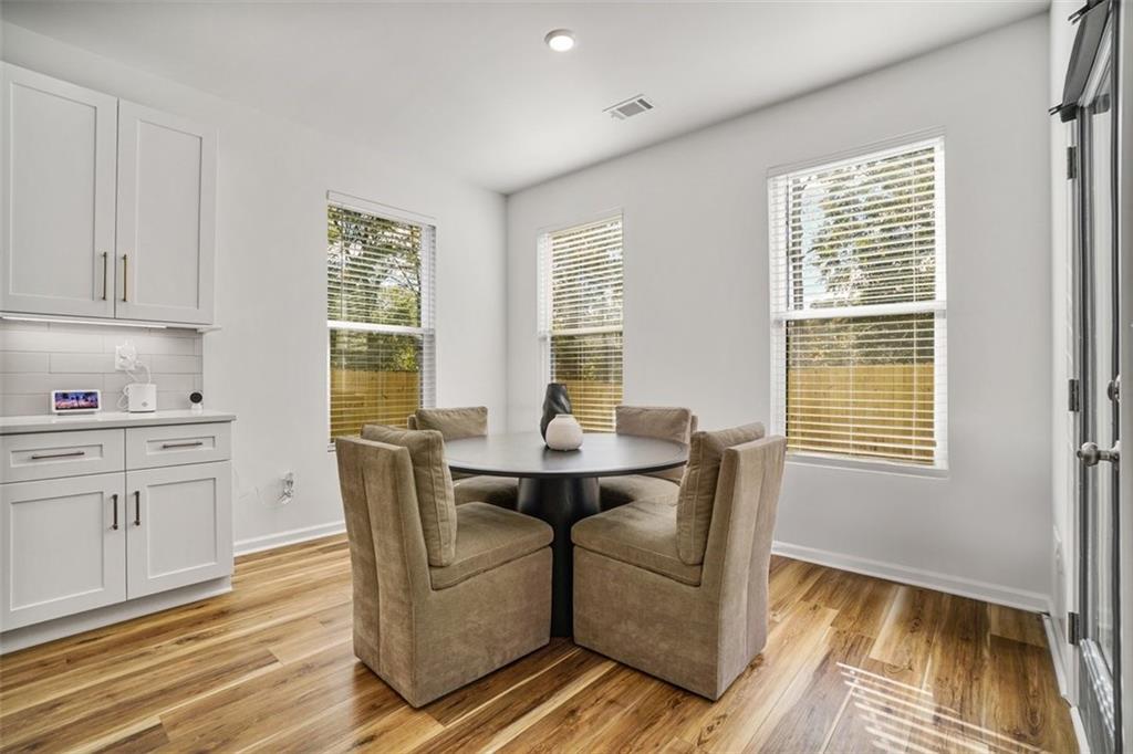 3510 Thompson Drive Northwest Atlanta, GA 30331 - Photo 20 of 28 a living room with furniture two windows and wooden floor