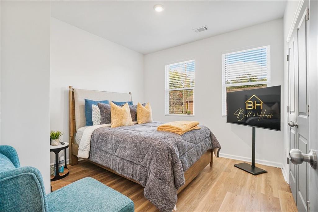 3510 Thompson Drive Northwest Atlanta, GA 30331 - Photo 26 of 28 a bedroom with a bed and a painting on the wall