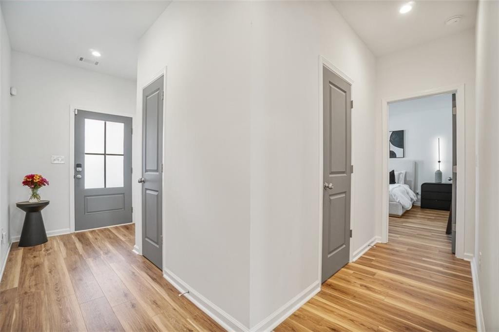 3510 Thompson Drive Northwest Atlanta, GA 30331 - Photo 4 of 28 a view of a bedroom with wooden floor and a bedroom