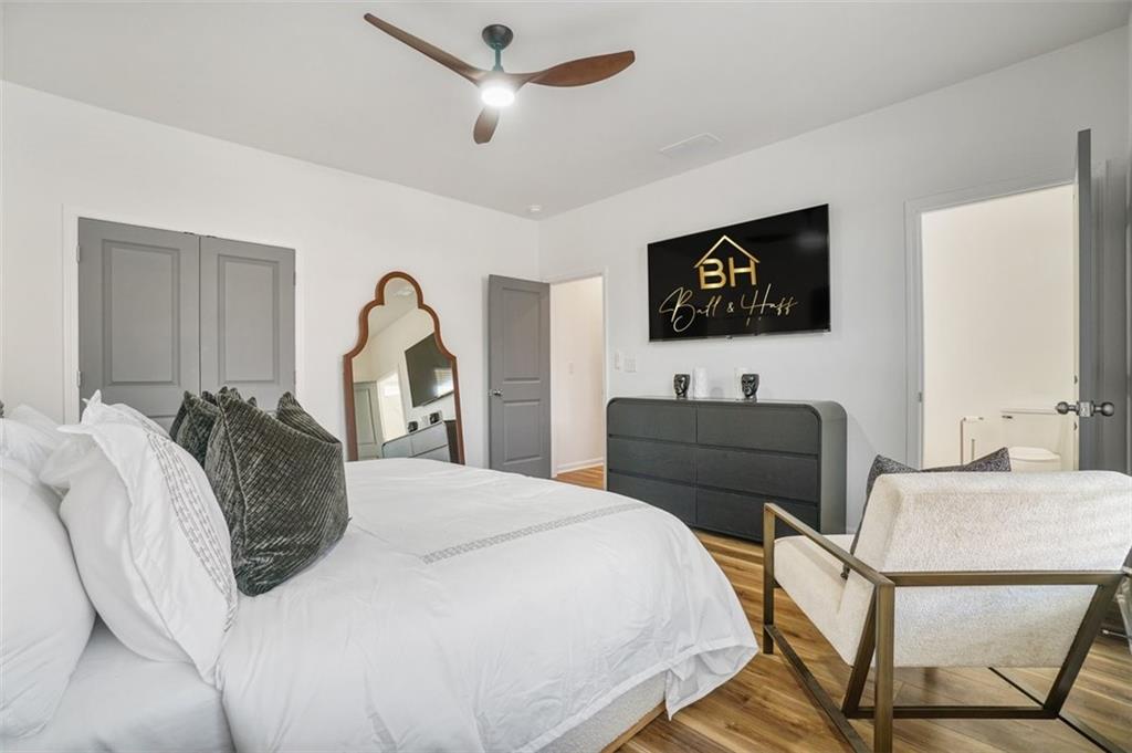 3510 Thompson Drive Northwest Atlanta, GA 30331 - Photo 7 of 28 a bedroom with a bed and a flat screen tv