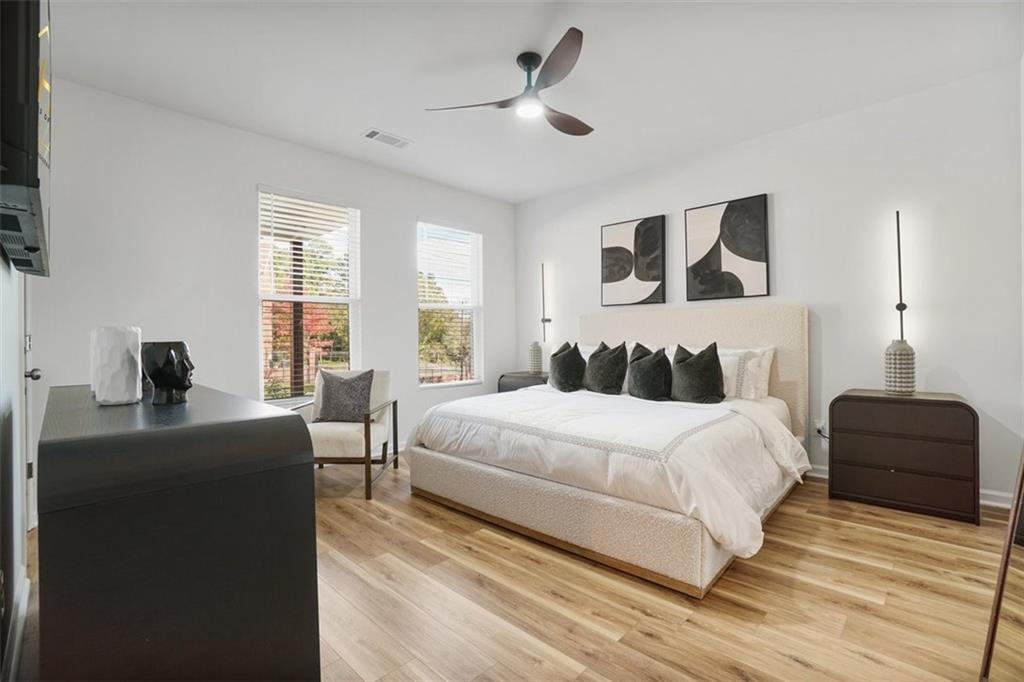 3510 Thompson Drive Northwest Atlanta, GA 30331 - Photo 8 of 28 a bedroom with a bed and a chandelier