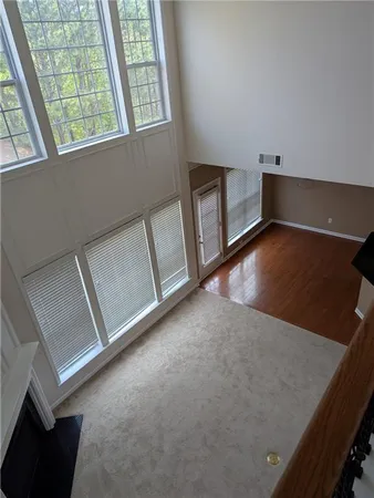 a view of an empty room with windows