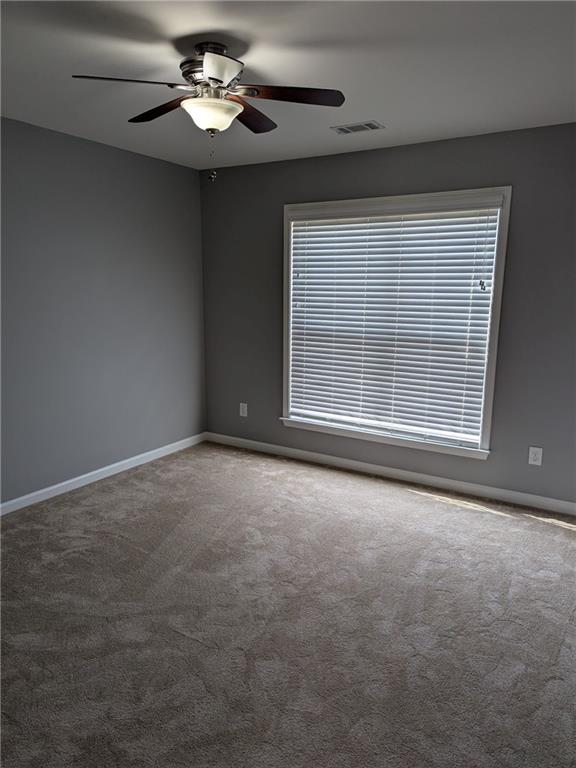 430 Floral Place Suwanee, GA 30024 - Photo 18 of 26 a view of an empty room with a window