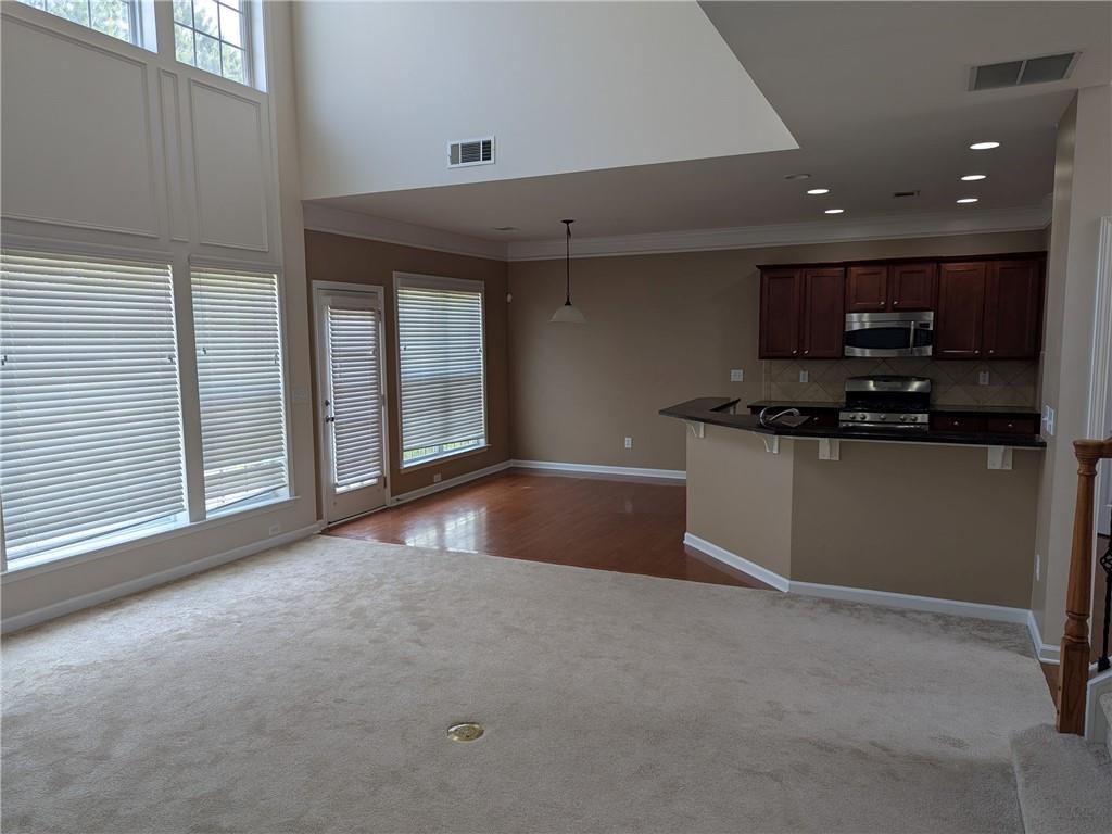 430 Floral Place Suwanee, GA 30024 - Photo 9 of 26 a view of kitchen with a sink and cabinets