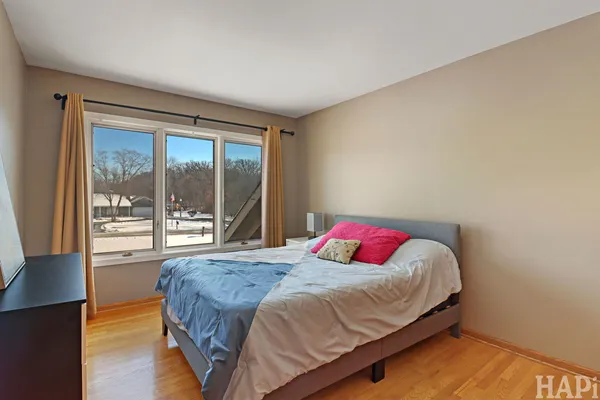 a bedroom with a bed and window