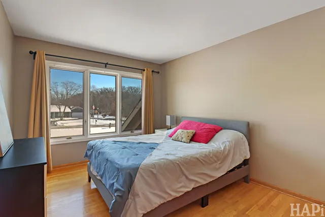 a bedroom with a bed and window