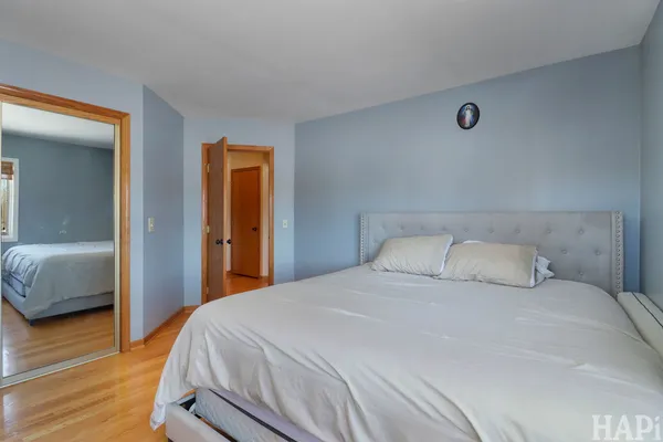 a bedroom with a bed and a walk in closet