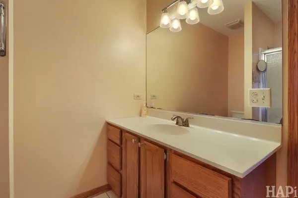 a bathroom with a sink a vanity and a mirror