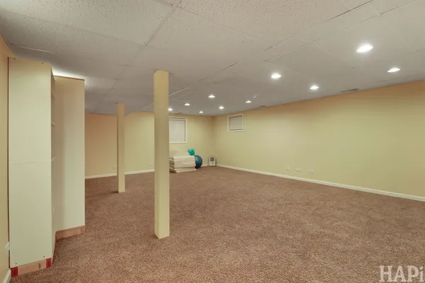 a view of a livingroom with a refrigerator