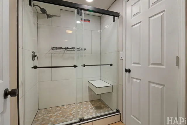 a bathroom with a shower and a toilet