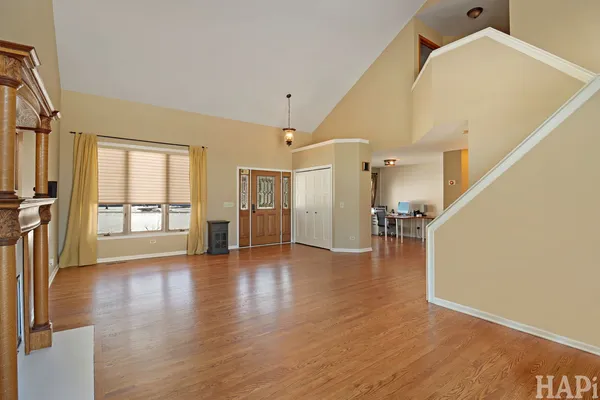 a view of an entryway with wooden floor
