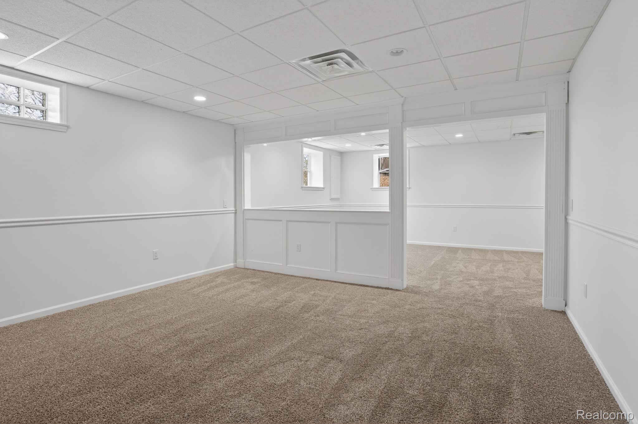 9055 Hegel Road Grand Blanc, MI 48439 - Photo 45 of 62 Carpeted room featuring white walls with chair rail molding and recessed lighting