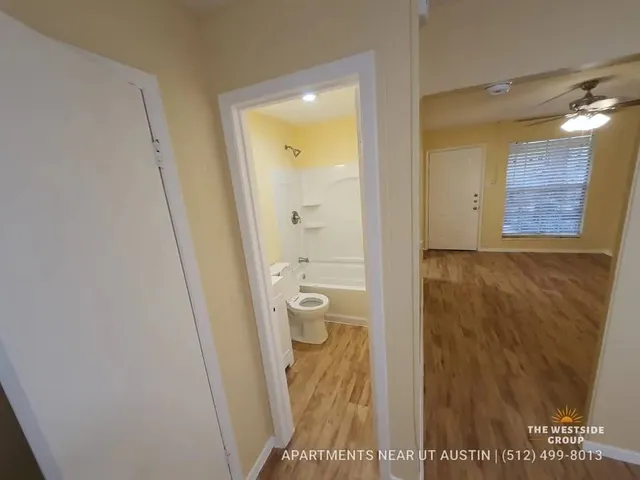 a bathroom with a shower and a toilet