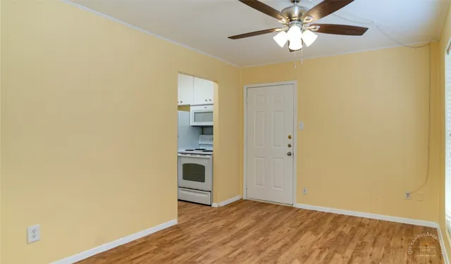 a view of a livingroom with a chandelier fan