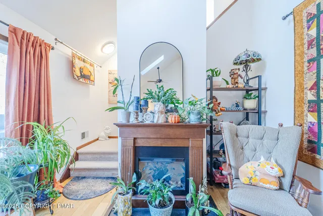 a living room with furniture and a fireplace