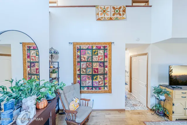 a view of a workspace room with furniture and toys
