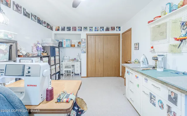 a living room with furniture and a kitchen