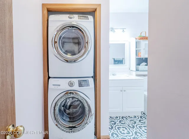 a utility room with sink dryer and washer