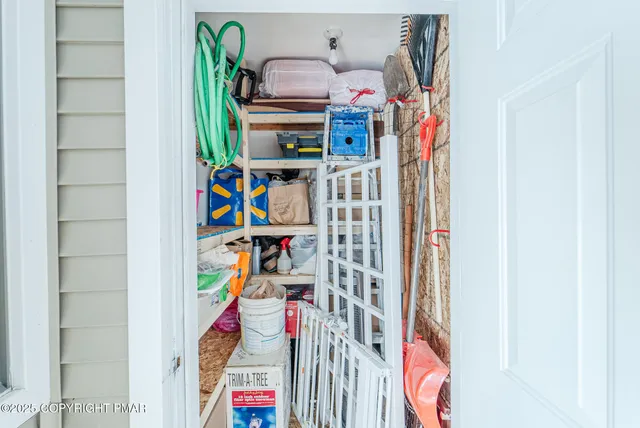 a view of a closet with storage