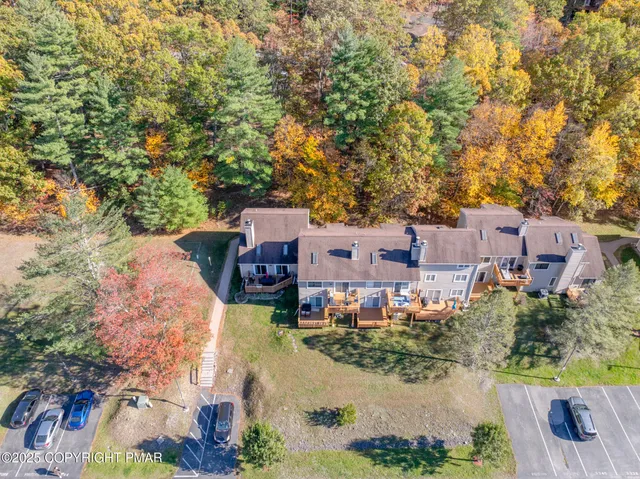 an aerial view of residential houses with outdoor space