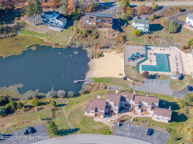 an aerial view of residential houses with outdoor space