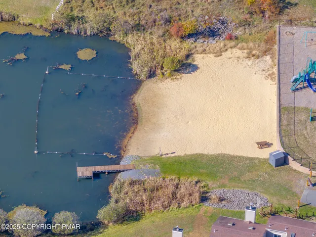 an aerial view of houses with yard