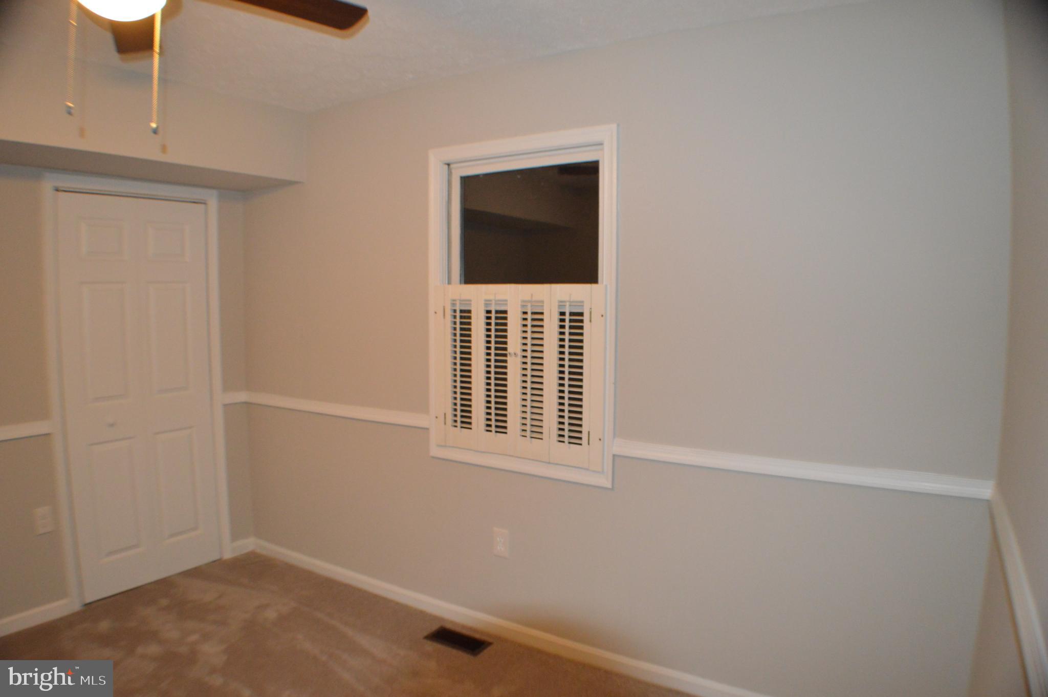 286 Riverside Drive Pasadena, MD 21122 - Photo 59 of 66 some windows have shutters, nice touch