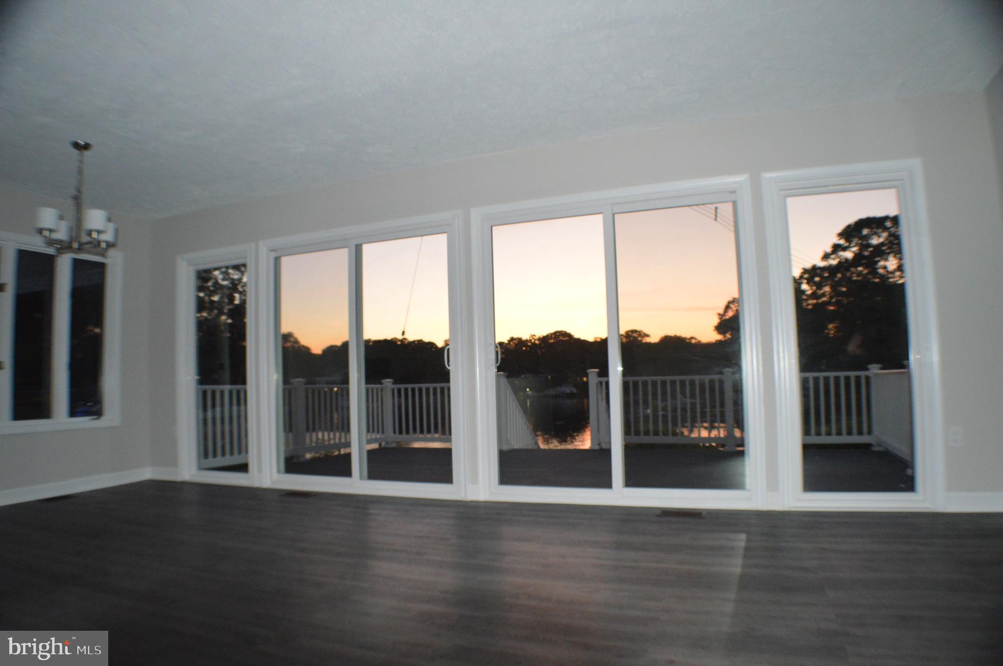 286 Riverside Drive Pasadena, MD 21122 - Photo 60 of 66 interior lights on at twilight