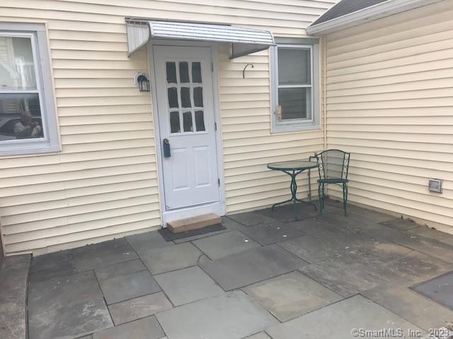 19 Greenfield Avenue Ridgefield, CT 06877 - Photo 13 of 28 a view of a house with a white wall and a large window