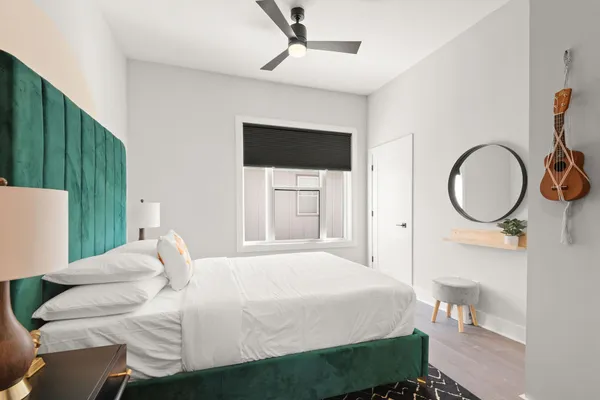 a bed room with a bed and a window