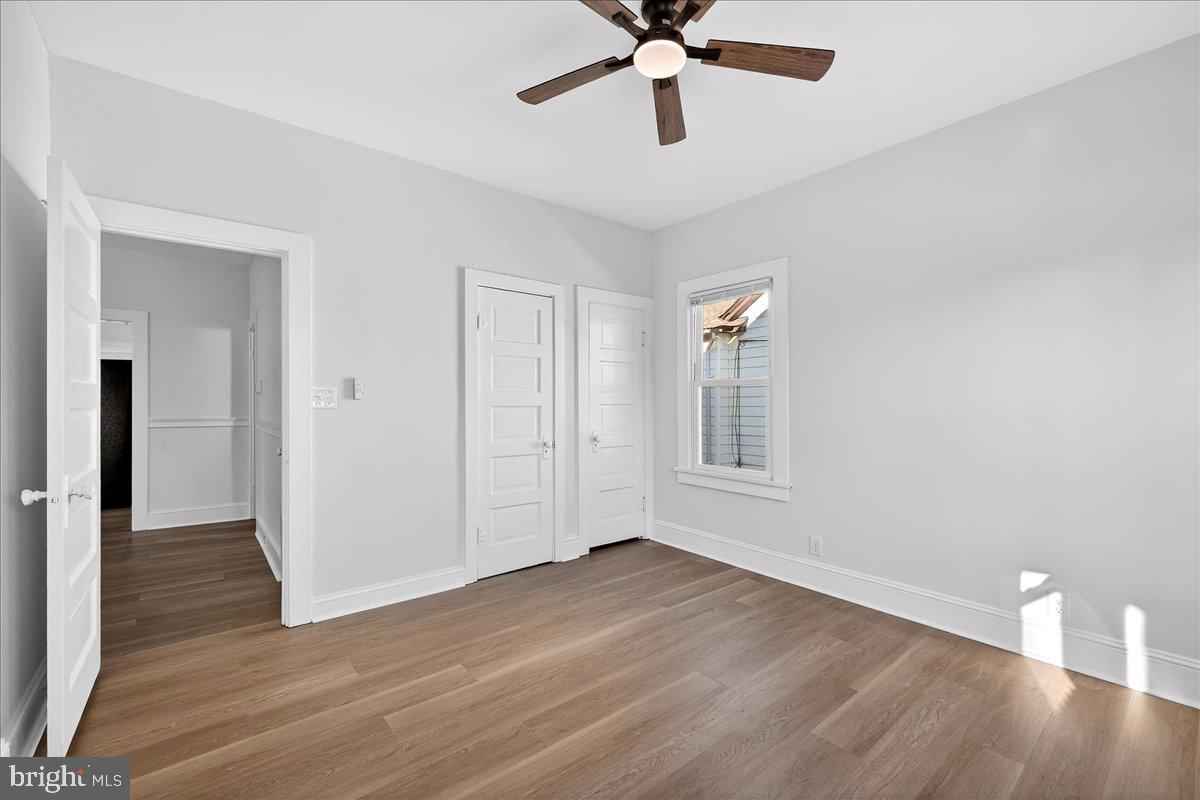 615 13th Street New Castle, DE 19720 - Photo 22 of 39 wooden floor in an empty room with a window