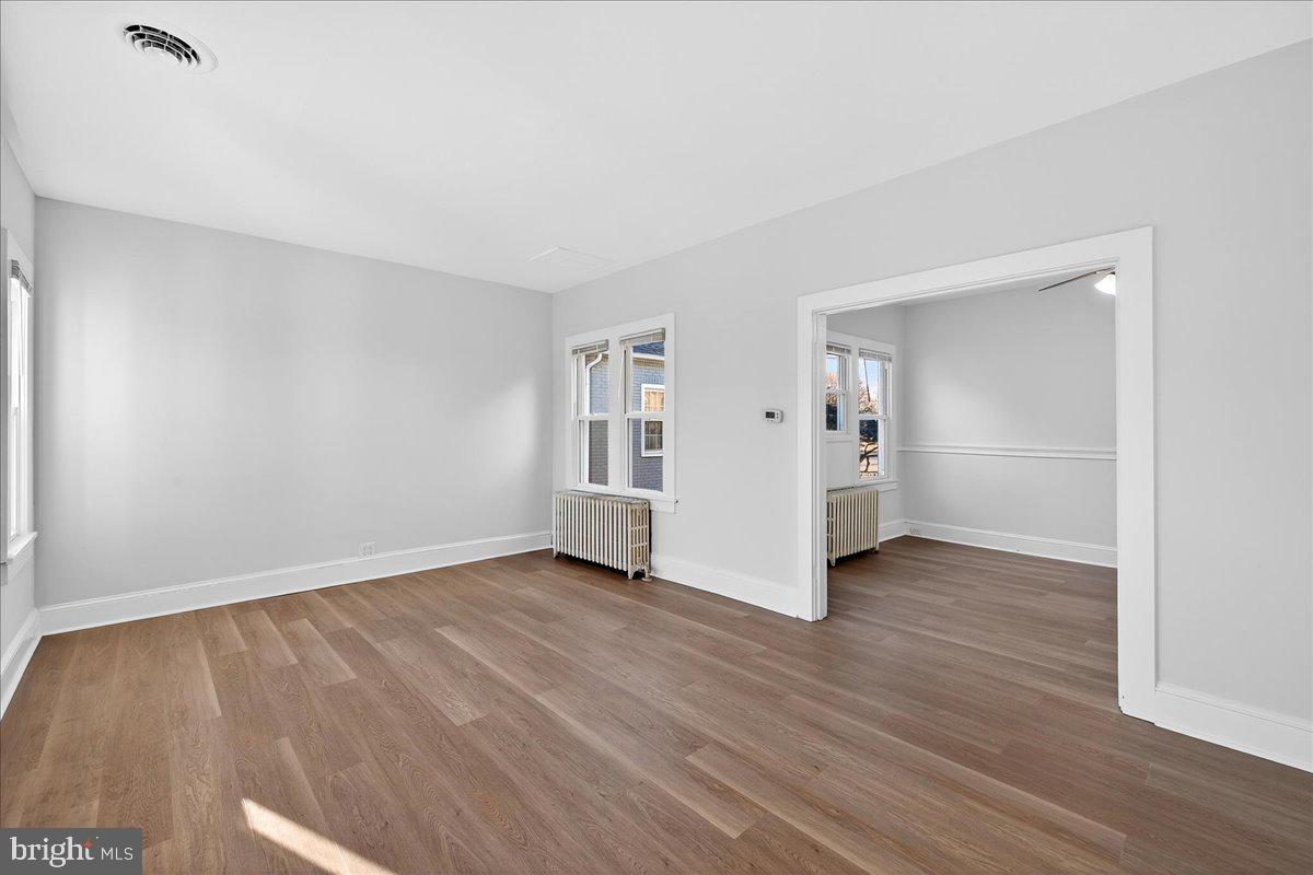 615 13th Street New Castle, DE 19720 - Photo 3 of 39 wooden floor in an empty room