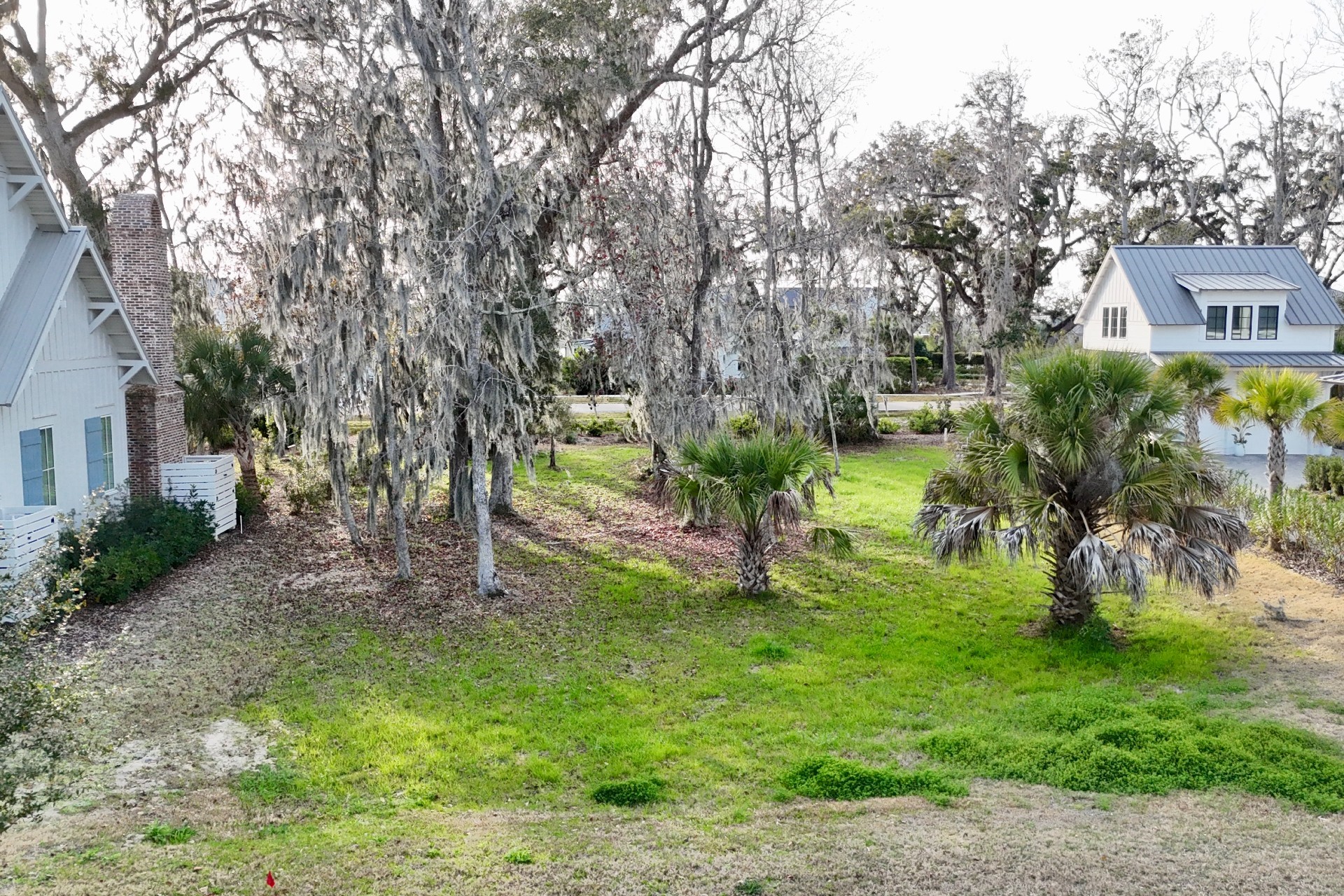 73 Broadbent Way Fernandina Beach, FL 32034 - Photo 7 of 21 a view of a backyard with plants and a patio