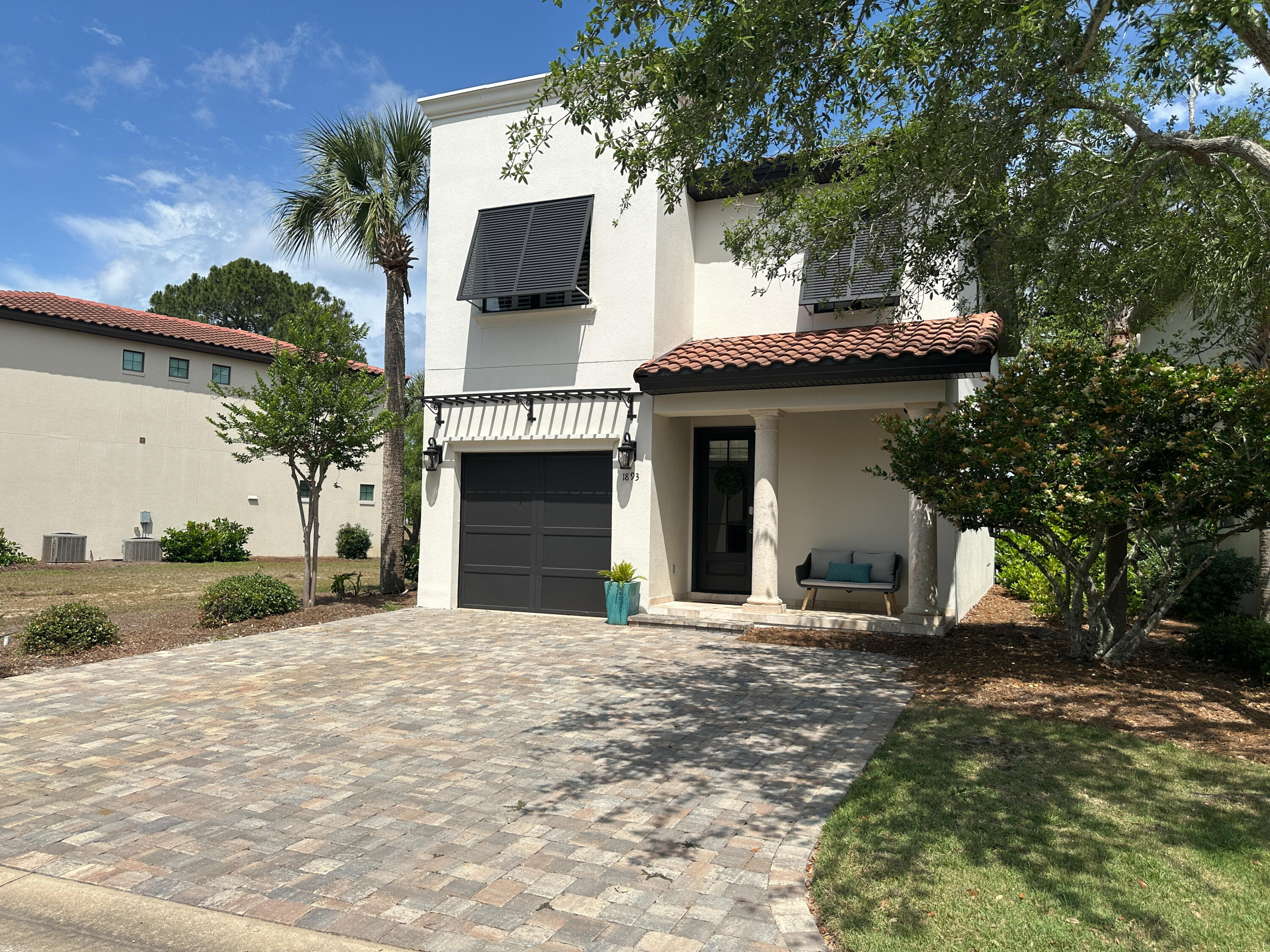 1893 Baytowne Loop Miramar Beach, FL 32550 - Photo 12 of 58 a front view of a house with a porch