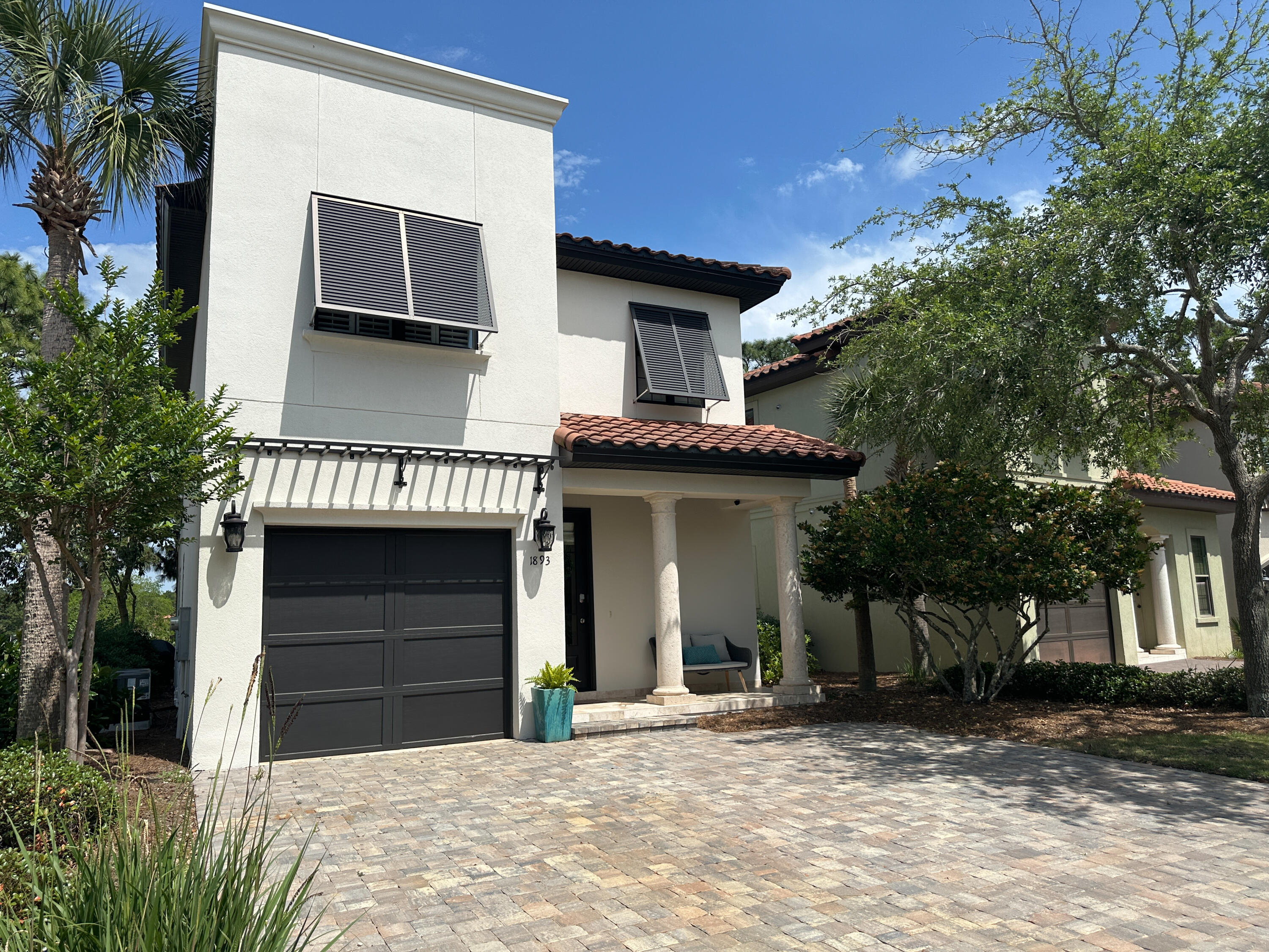 1893 Baytowne Loop Miramar Beach, FL 32550 - Photo 13 of 58 a front view of a house with a garage