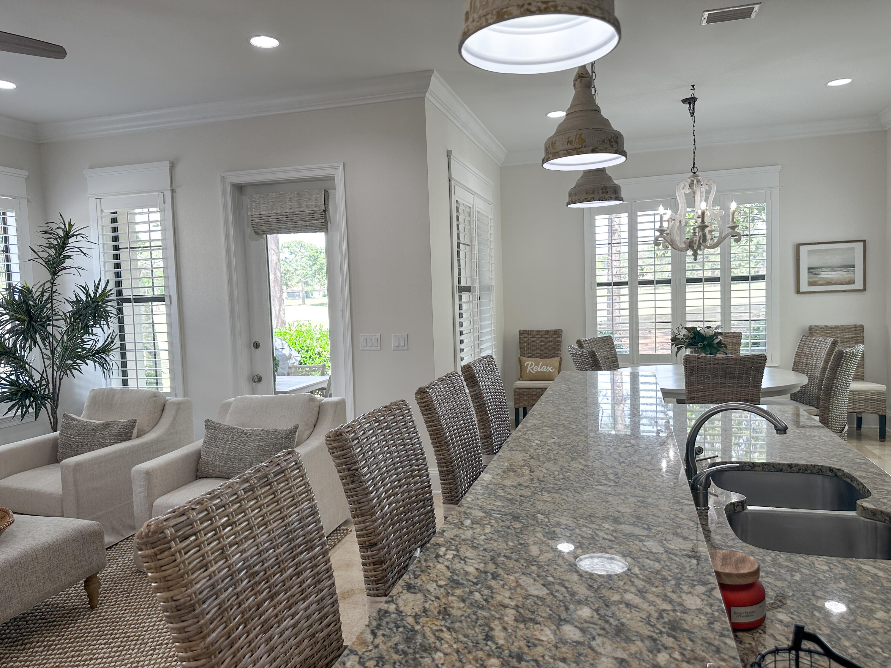 1893 Baytowne Loop Miramar Beach, FL 32550 - Photo 21 of 58 a living room with furniture a chandelier and a dining room